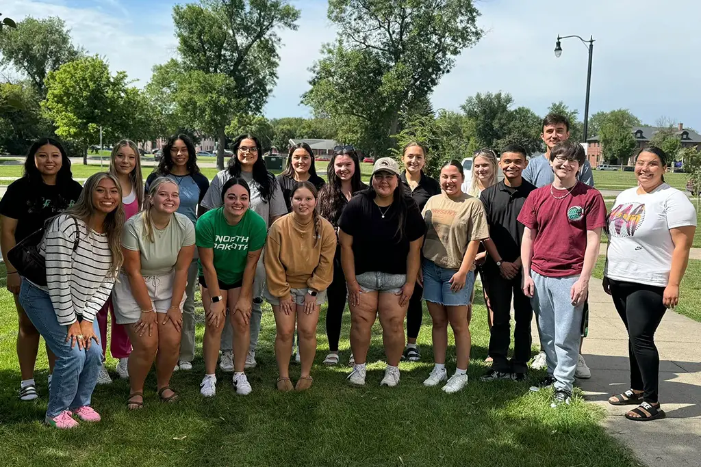 A large group of RAIN students assembled for a photo outside